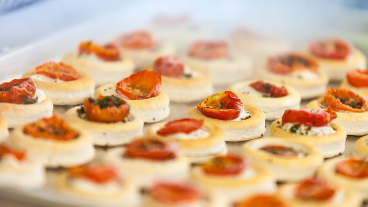 Frozen appetizers exiting a tunnel freezer